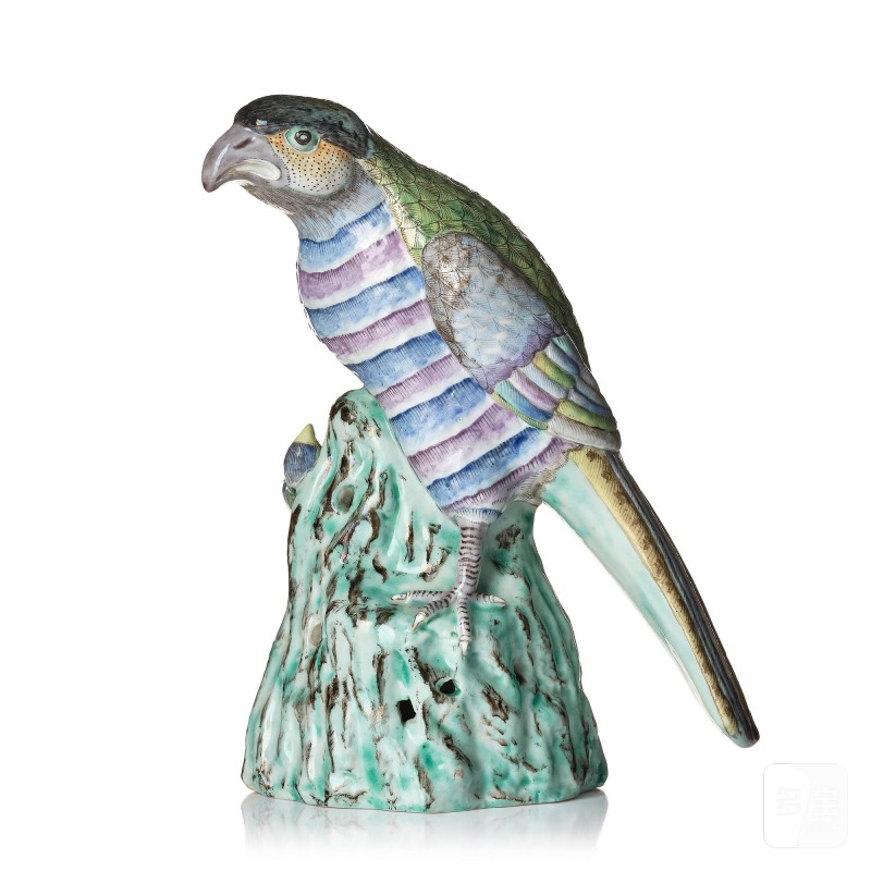 A rare famille rose figure of a hawk with its pray,